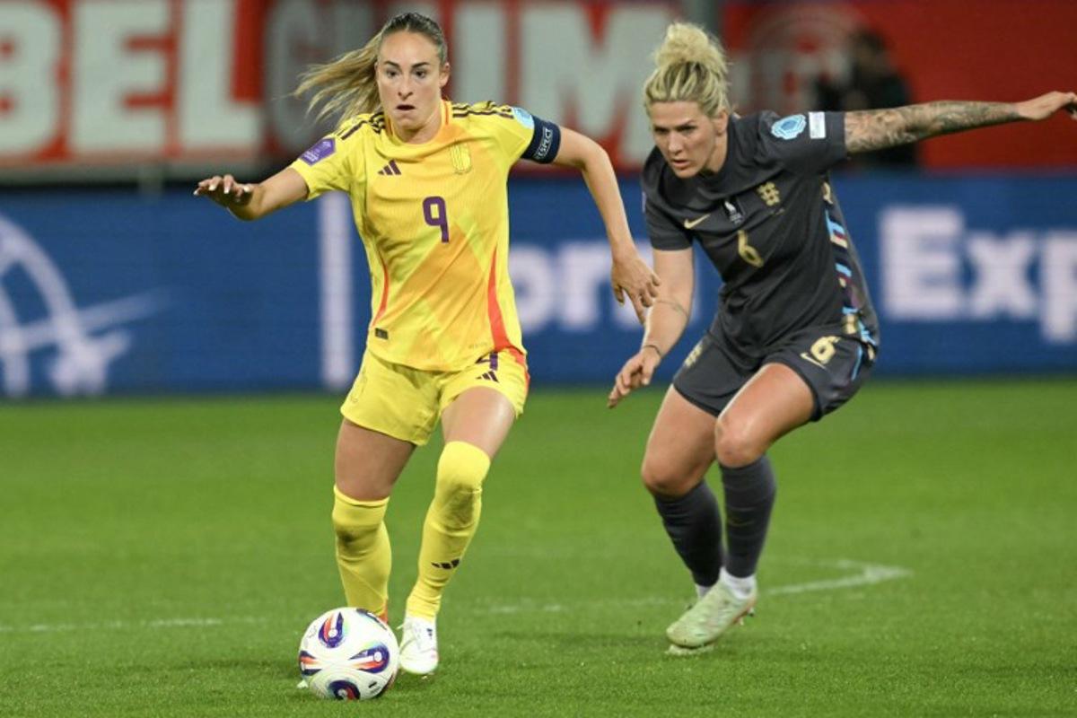 Belgium's forward #09 Tessa Wullaert (L) controls the ball, pursued by England's defender #06 Millie Bright (R) during the UEFA Women's Nations League Group A3 football match between Belgium and England at the Den Dreef stadium in Heverlee, outside Leuven, on April 8, 2025.  NICOLAS TUCAT / AFP