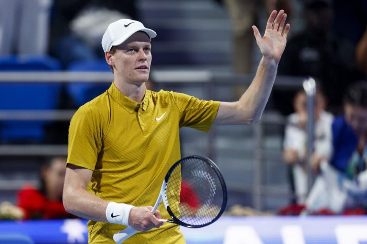 Italy's Jannik Sinner greets the fans after defeating Australia's Alexei Popyrin in their men's singles match at the Qatar Open tennis tournament in Doha on February 18, 2026.  Karim JAAFAR / AFP