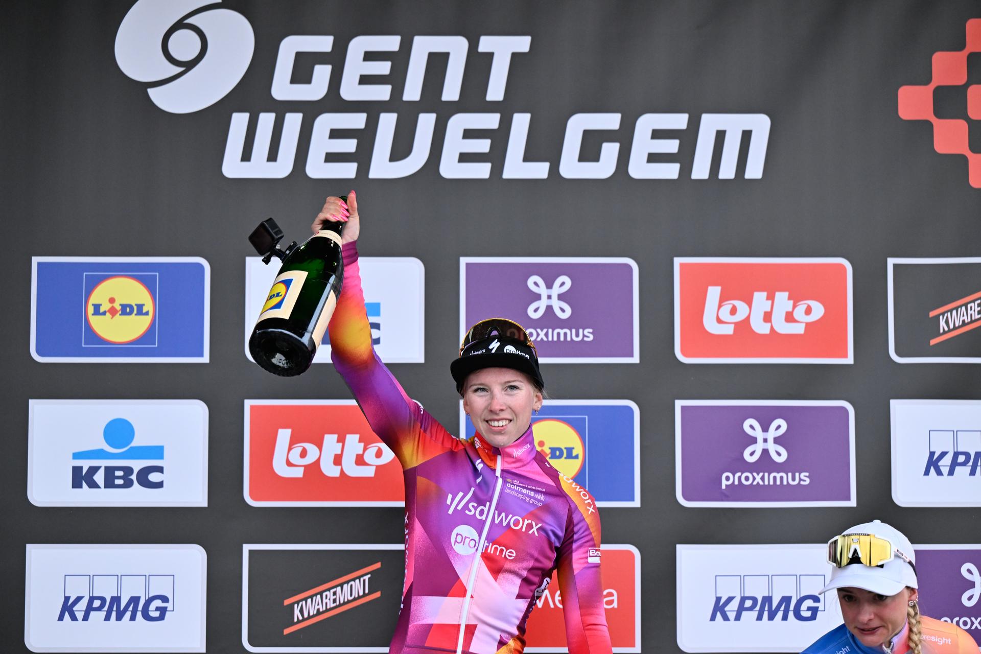 Dutch Lorena Wiebes of SD Worx - Protime celebrates on the podium after winning the women's Gent-Wevelgem - In Flanders Fields cycling race, 171.2 km from Ieper to Wevelgem, Sunday 24 March 2024. BELGA PHOTO ERIC LALMAND