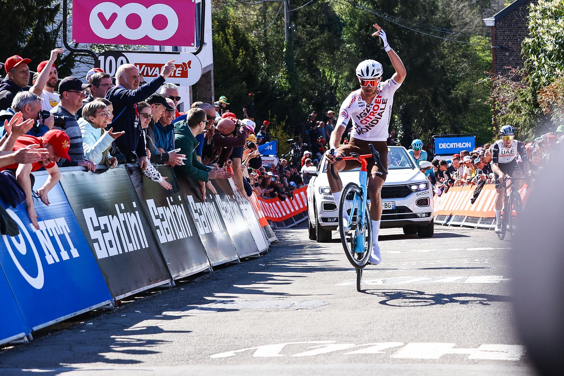 French Bastien Tronchon of AG2R Citroen shows a wheelie on the Mur de Huy-Muur van Hoei during the 86th edition of the men's race 'La Fleche Wallonne', a one day cycling race (Waalse Pijl - Walloon Arrow), 194,2 km from Herve to Huy, Wednesday 19 April 2023. BELGA PHOTO DAVID PINTENS