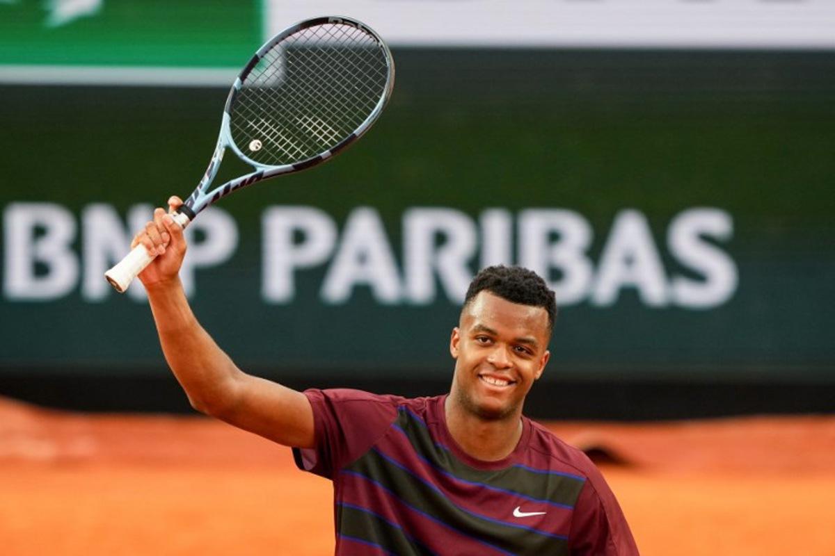 France's Giovanni Mpetshi Perricard celebrates after winning his men's singles match against Belgium's Zizou Bergs on day 1 of the French Open tennis tournament on Court Suzanne-Lenglen at the Roland-Garros Complex in Paris on May 25, 2025.  Dimitar DILKOFF / AFP