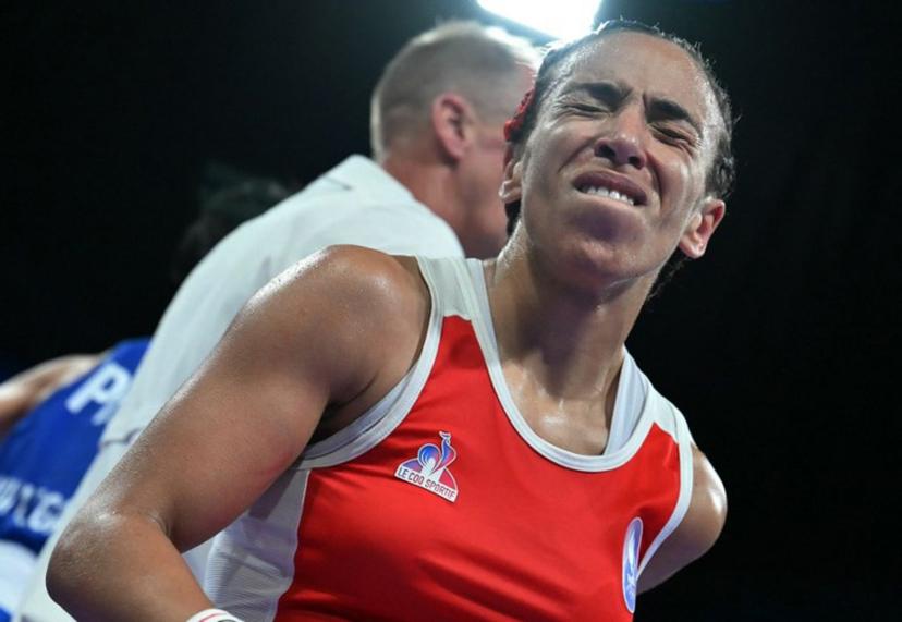 France's Wassila Lkhadiri reacts at the end of the match against Philippines' Aira Villegas in the women's 50kg quarter-final boxing match during the Paris 2024 Olympic Games at the North Paris Arena, in Villepinte on August 3, 2024.  MOHD RASFAN / AFP