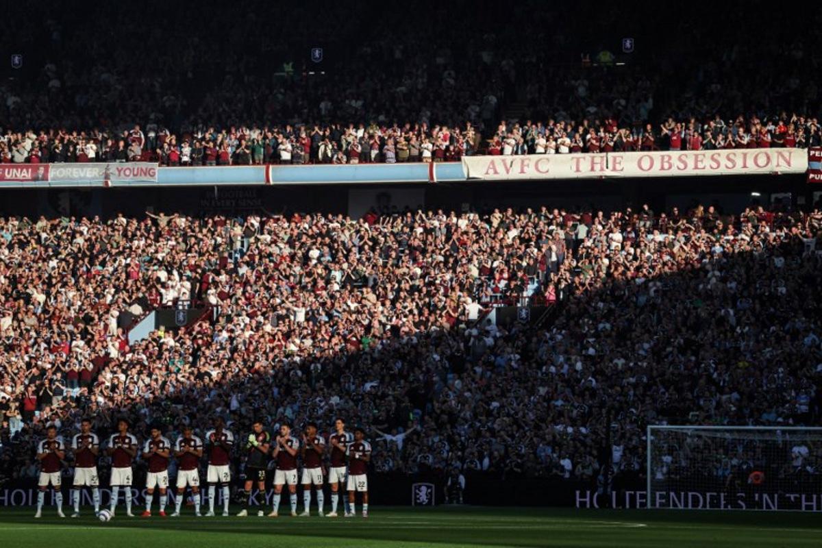 Aston Vill's team players applaud after a tribute to late former players during the English Premier League football match between Aston Villa and Tottenham Hotspur at Villa Park in Birmingham, central England on May 16, 2025.  Darren Staples / AFP