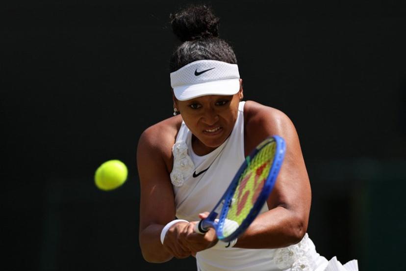 Japan's Naomi Osaka returns to Australia's Daria Kasatkina during their women's singles third round tennis match on the fifth day of the 2026 Wimbledon Championships at The All England Lawn Tennis and Croquet Club in Wimbledon, southwest London, on July 3, 2026.  Adrian DENNIS / AFP