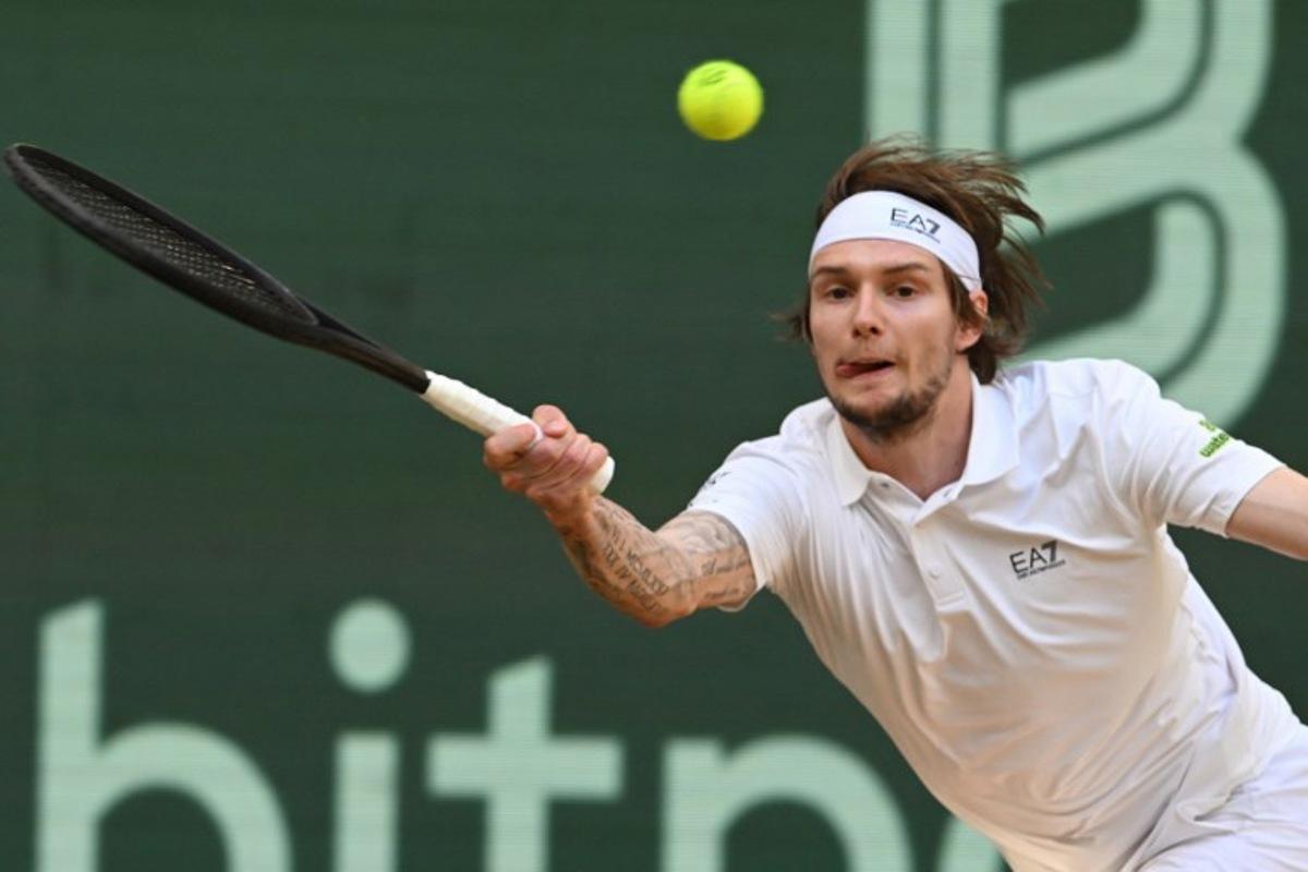 Kazakhstan's Alexander Bublik returns the ball to Russia's Karen Khachanov (not in picture) during the men's singles semi-final match at the Halle Open ATP tennis tournament in Halle, western Germany, on June 21, 2025.  CARMEN JASPERSEN / AFP