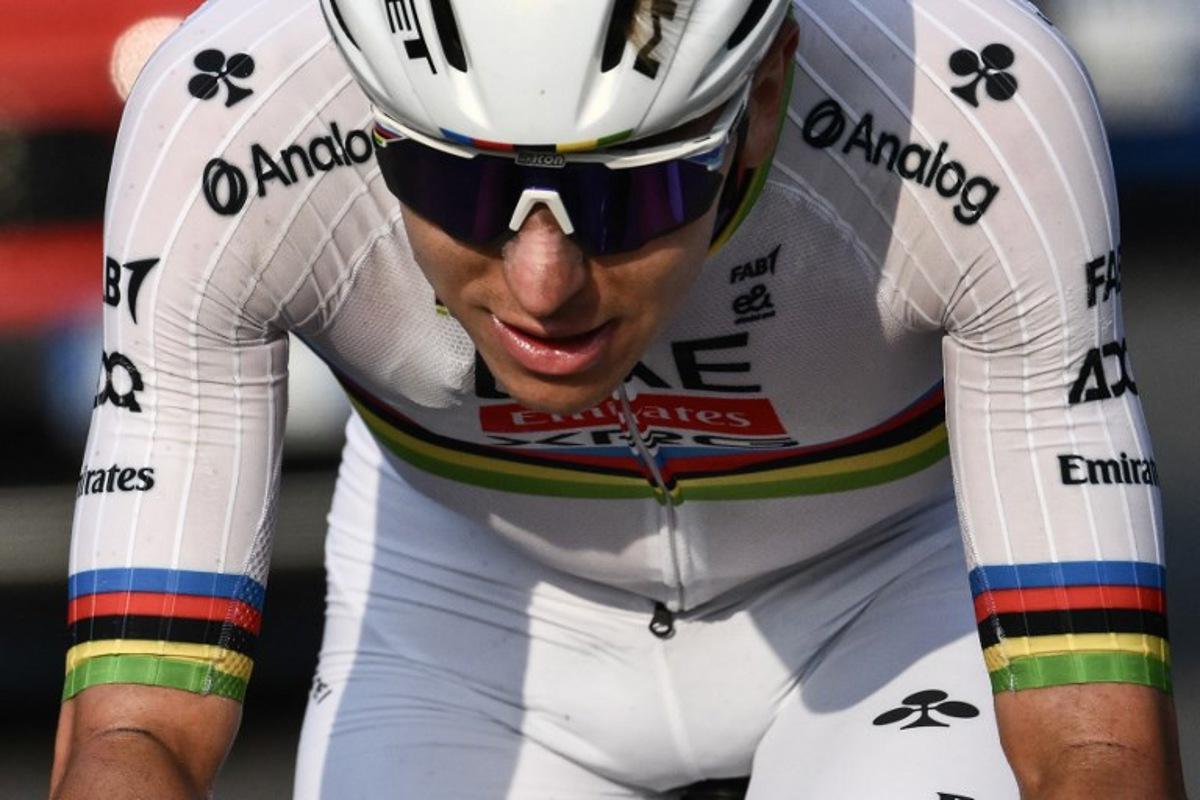 UAE Team Emirates's Slovenian rider Tadej Pogacar cycles in a lone breakawy in the Passo Di Ganda descent during the 119th edition of the Giro di Lombardia (Tour of Lombardy), a 238km cycling race from Como to Bergamo on October 11, 2025.  Marco BERTORELLO / AFP