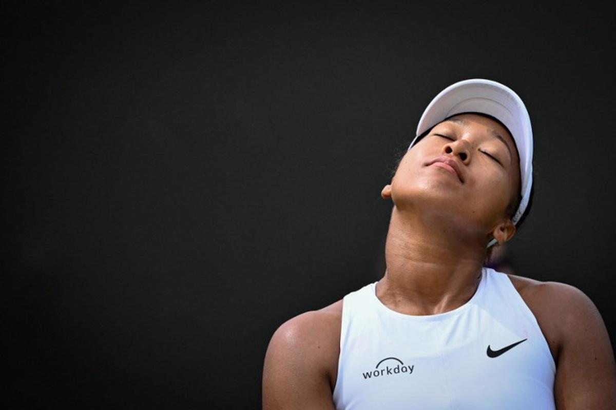 Japan's Naomi Osaka reacts as she plays against Russia's Anastasia Pavlyuchenkova during their women's singles third round tennis match on the fifth day of the 2025 Wimbledon Championships at The All England Lawn Tennis and Croquet Club in Wimbledon, southwest London, on July 4, 2025.  Kirill KUDRYAVTSEV / AFP