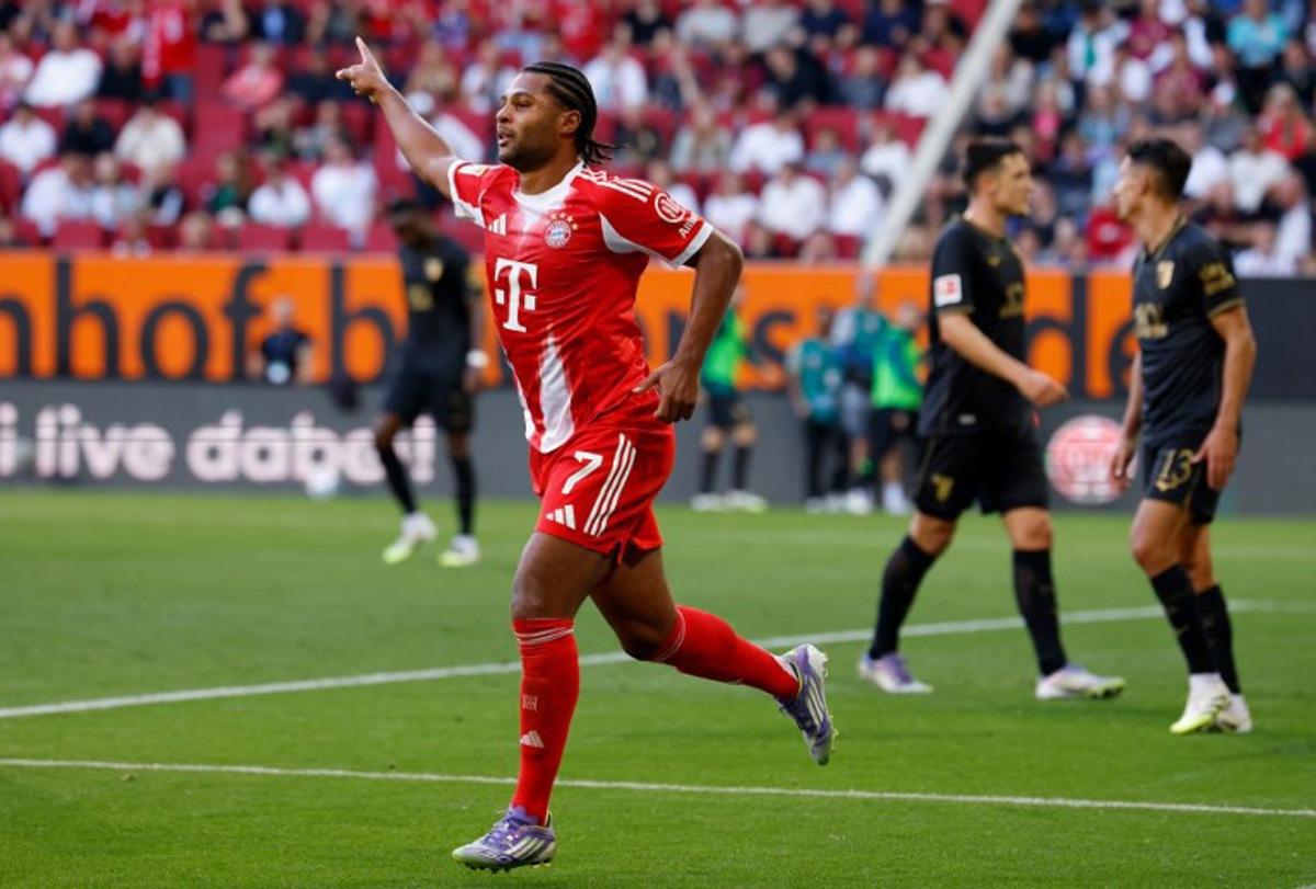 Bayern Munich's German forward #07 Serge Gnabry celebrates scoring the opening goal during the German first division Bundesliga football match between FC Augsburg and FC Bayern Munich in Augsburg, southern Germany, on August 30, 2025.  Michaela STACHE / AFP