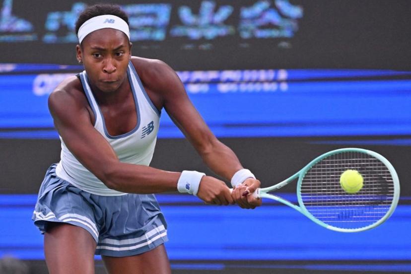 USA's Coco Gauff hits a return to Italy's Jasmine Paolini during their women's singles semi-final match at the Wuhan Open tennis tournament in Wuhan, Central China's Hubei province on October 11, 2025.  ADEK BERRY / AFP