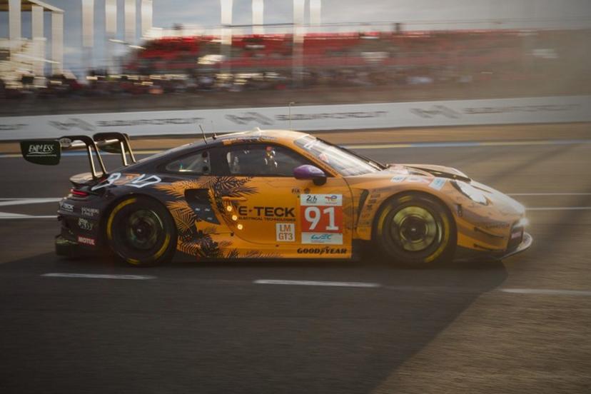 Austrian driver Richard Lietz competes in his Porsche 911 GT3 R LMGT3 as the sun sets during the Le Mans 24-hours endurance race at the Le Mans racetrack, in Le Mans, western France, on June 15, 2024.  GUILLAUME SOUVANT / AFP