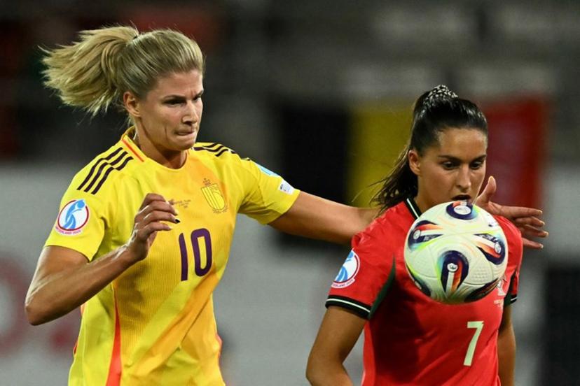 Belgium's midfielder #10 Justine Vanhaevermaet and Portugal's forward #07 Francisca Nazareth eye the ball during the UEFA Women's Euro 2025 Group B football match between Portugal and Belgium at the Stade de Tourbillon in Sion, on July 11, 2025.  Fabrice COFFRINI / AFP