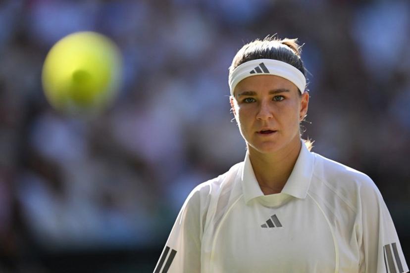 Czech Republic's Karolina Muchova focuses on the ball whilst playing against Czech Republic's Linda Noskova during their women's singles final tennis match on the thirteenth day of the 2026 Wimbledon Championships at The All England Lawn Tennis and Croquet Club in Wimbledon, southwest London, on July 11, 2026.  Kirill KUDRYAVTSEV / AFP