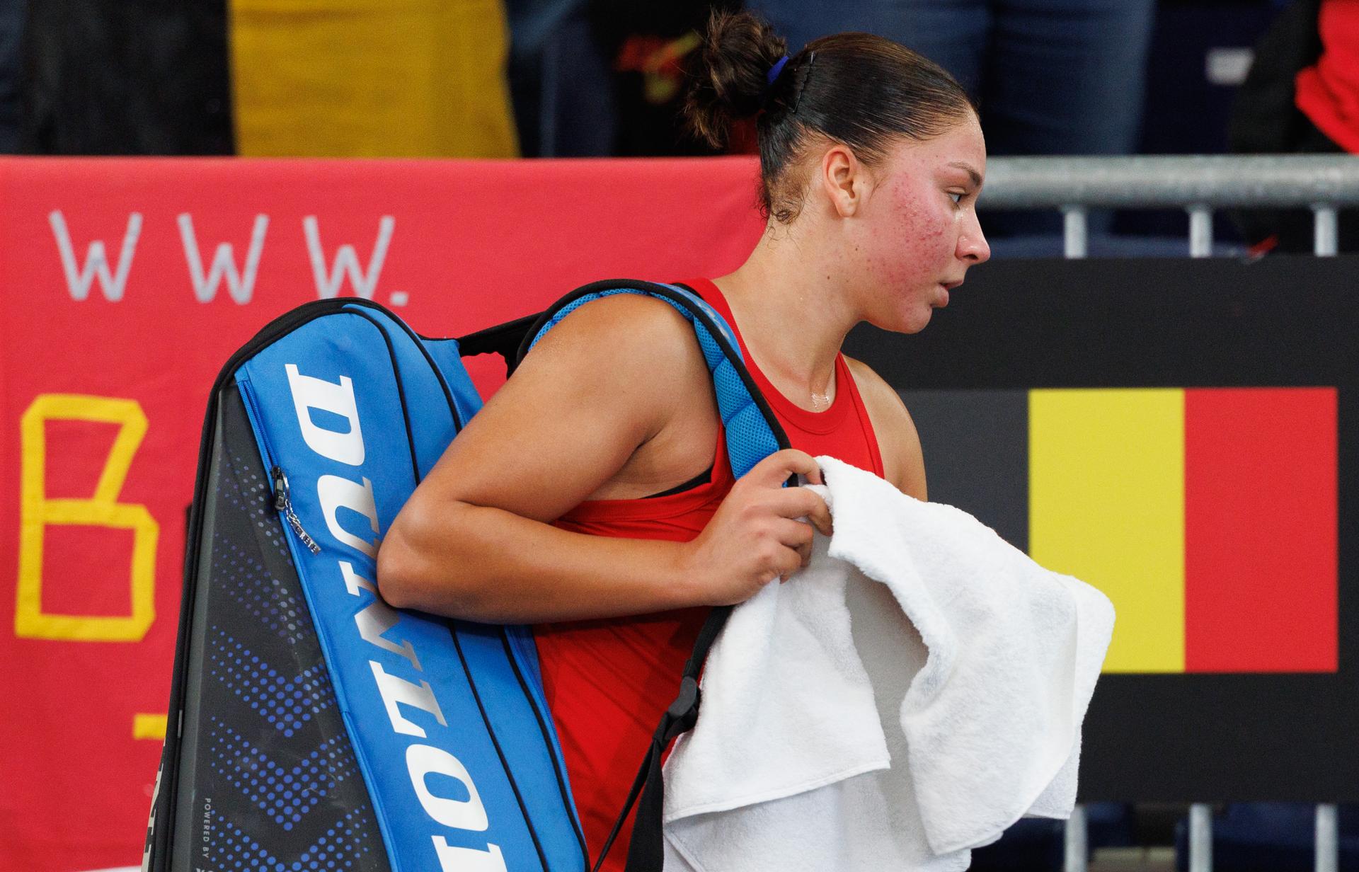 Belgian Sofia Costoulas looks dejected after the first game between Belgian Costoulas and Turkish Aksu in the Billie Jean King Cup Play-offs, between Belgium and Turkey, on Saturday 15 November 2025 in Ismaning, Germany. PHOTO BENOIT DOPPAGNE
