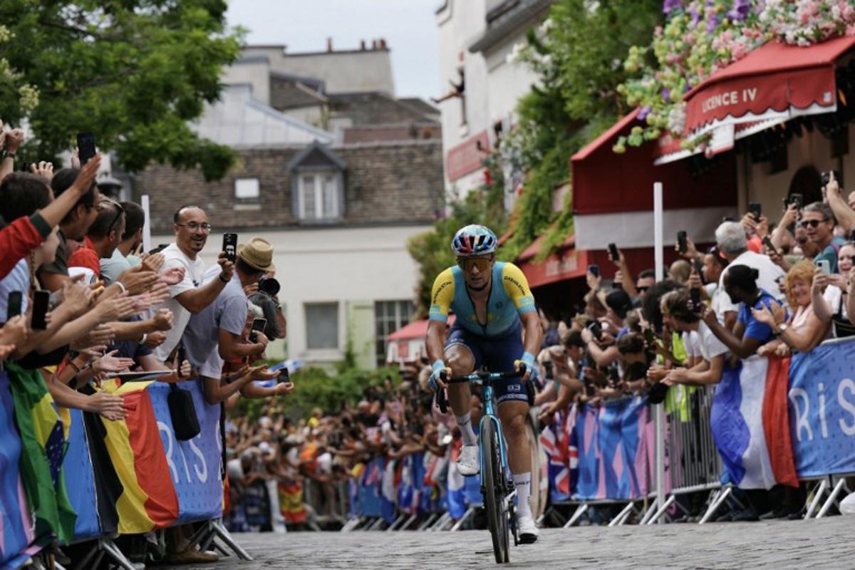 Kazakhstan's Alexey Lutsenko cycles in Montmartre during the men's cycling road race during the Paris 2024 Olympic Games in Paris, on August 3, 2024.   Dimitar DILKOFF / AFP