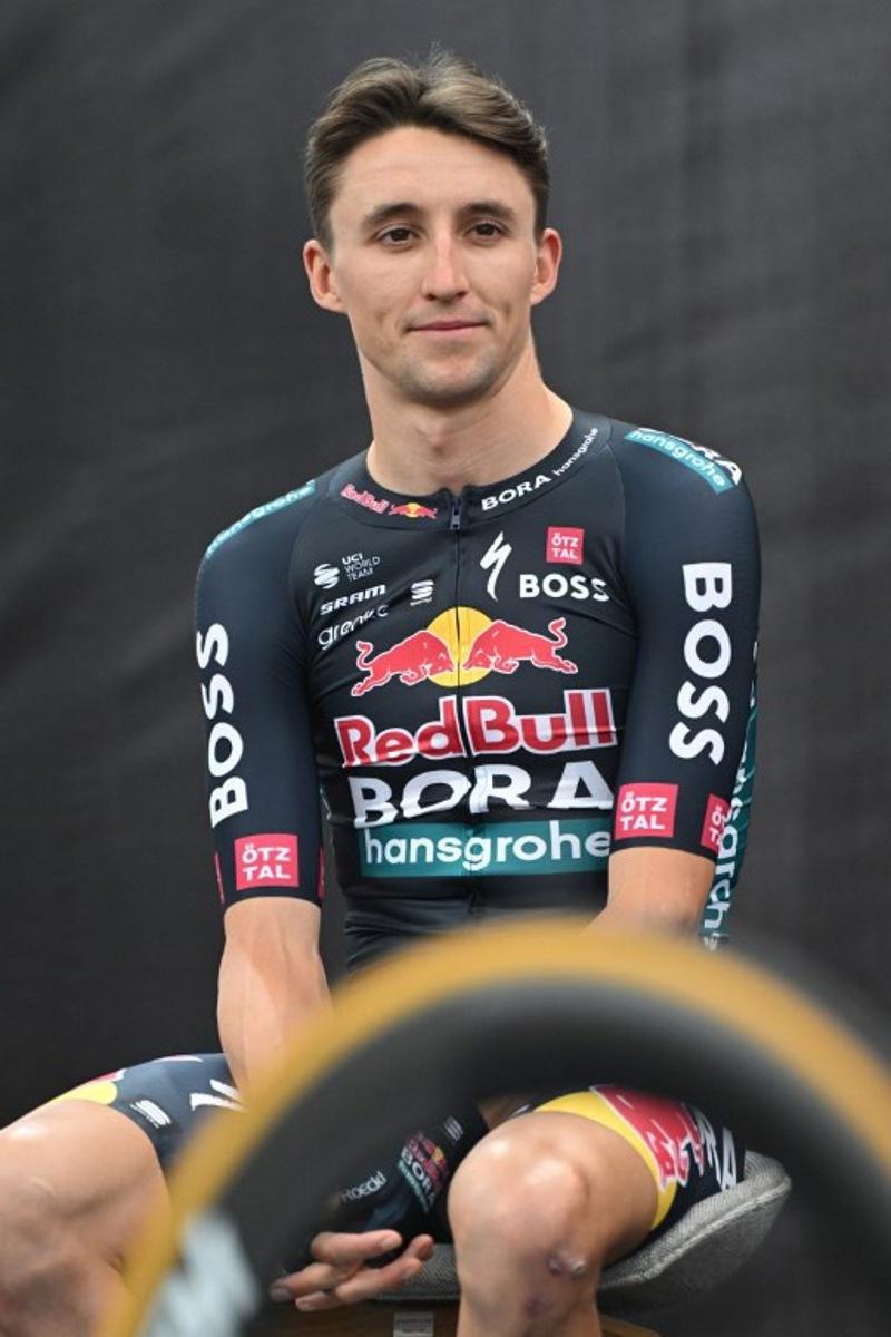 Australia's Jai Hindley attends the presentation of the new Red Bull-Bora-Hansgrohe cycling team in Salzburg, Austria, on June 26, 2024. Red Bull on June 26, 2024 unveiled its eight-rider cycling team to debut in this week's Tour de France, marking the energy drink maker's latest expansion of its sports empire. Earlier this year, Red Bull bought a controlling stake in the German Bora-Hansgrohe cycling team.  KERSTIN JOENSSON / AFP