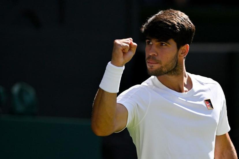 Spain's Carlos Alcaraz celebrates winning the third set against US player Taylor Fritz during their men's singles semi-final tennis match on the twelfth day of the 2025 Wimbledon Championships at The All England Lawn Tennis and Croquet Club in Wimbledon, southwest London, on July 11, 2025.  Glyn KIRK / AFP