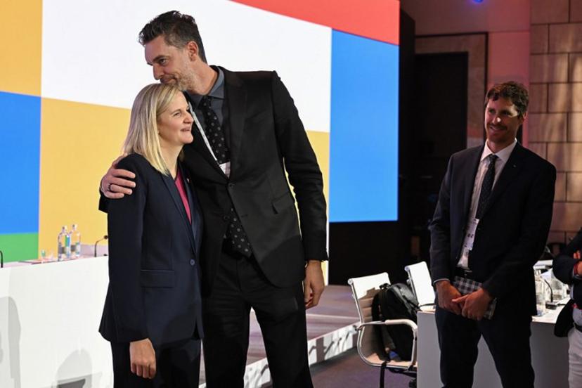 Zimbabwean candidate for the presidency of the International Olympic Committee (IOC) Kirsty Coventry (L) is congratulated by Former Spanish basketball player Pau Gasol (C) after being elected during the 144th IOC Session on the day of the election of the next President of the International Olympic Committee (IOC), in Costa Navarino, Greece on March 20, 2025. Zimbabwe's Kirsty Coventry was elected president of International Olympic Committee on March 20, 2025.  Fabrice COFFRINI / AFP