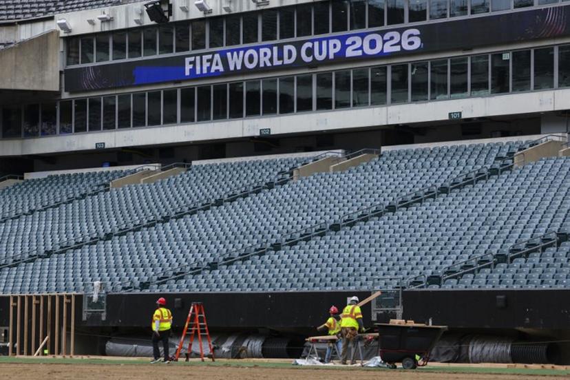 Workers prepare the field at Lincoln Financial Field, one of the stadiums hosting the 2026 FIFA World Cup at Lincoln Financial Field in Philadelphia, on April 28, 2026.  ANGELA WEISS / AFP