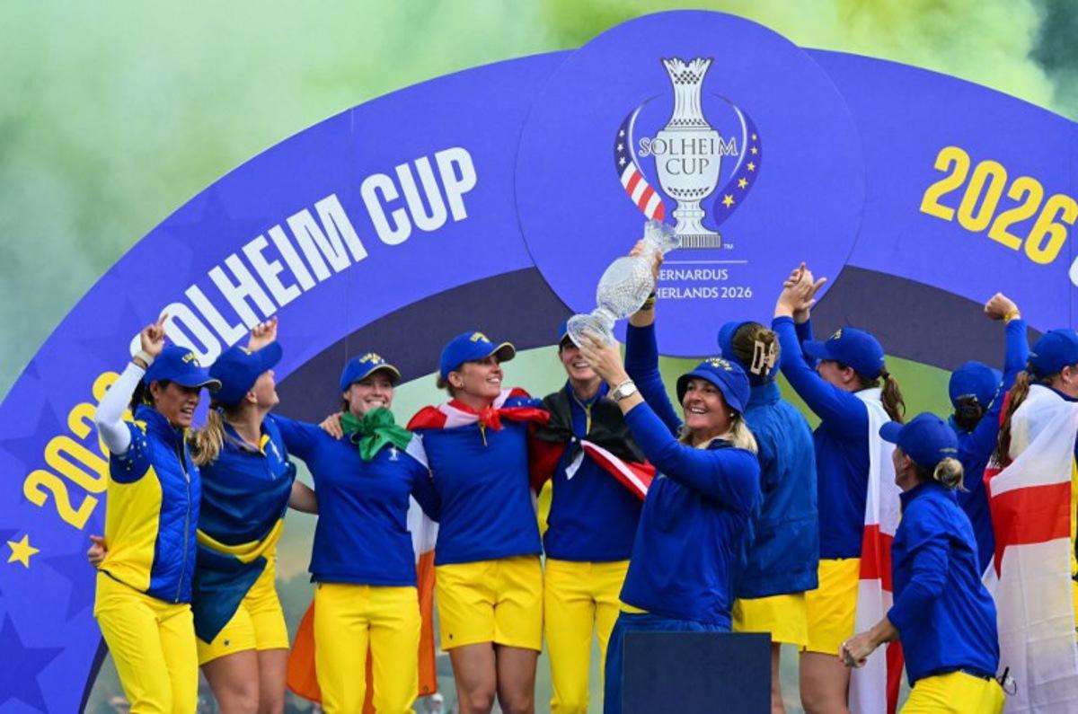 Team Europe's Swedish captain Anna Nordqvist (C) lifts the trophy after victory on the final day of the 2026 Solheim Cup biennial team golf competition on The Bernardus Golf Course at Cromvoirt, some 80kms south-east of Rotterdam on September 13, 2026.   NICOLAS TUCAT / AFP