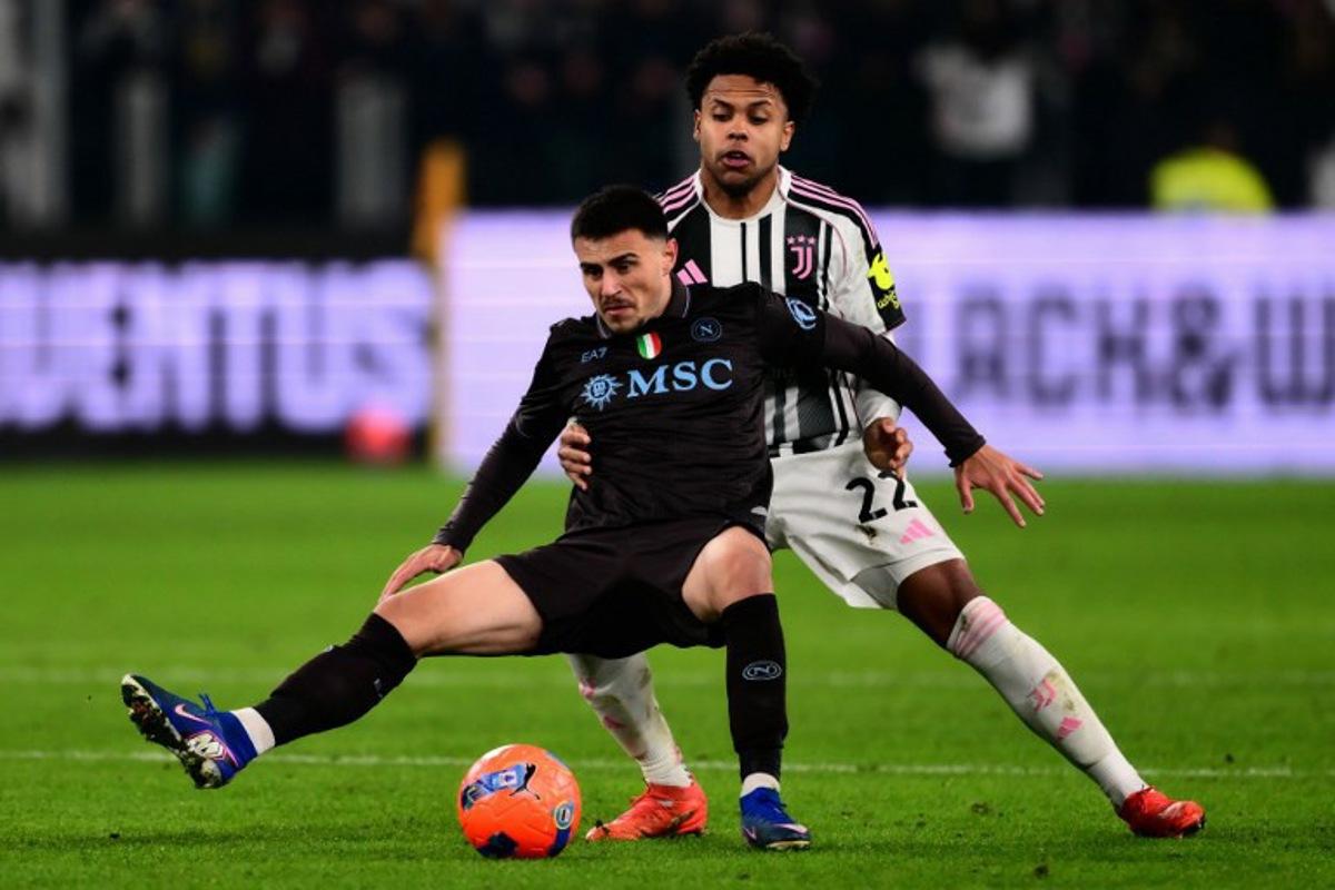 Napoli's Macedonian midfielder #20 Eljif Elmas (front) vies with Juventus' US midfielder #22 Weston McKennie during the Italian Serie A football match between Juventus and Napoli at the Allianz Stadium in Turin on January 25, 2026.  MARCO BERTORELLO / AFP