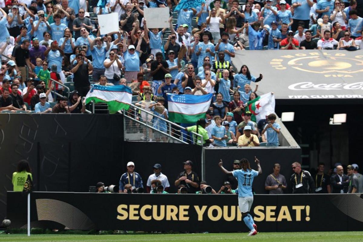 Manchester City's Belgian midfielder #11 Jeremy Doku celebrates scoring his team's second goal during the FIFA Club World Cup 2025 Group G football match between England's Manchester City and Morocco's Wydad AC at the Lincoln Financial Field stadium in Philadelphia on June 18, 2025.  FRANCK FIFE / AFP