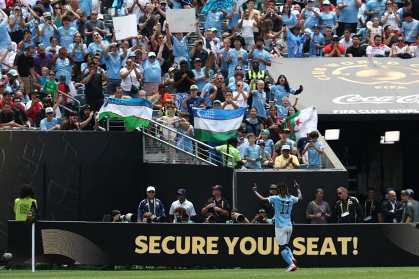 Manchester City's Belgian midfielder #11 Jeremy Doku celebrates scoring his team's second goal during the FIFA Club World Cup 2025 Group G football match between England's Manchester City and Morocco's Wydad AC at the Lincoln Financial Field stadium in Philadelphia on June 18, 2025.  FRANCK FIFE / AFP