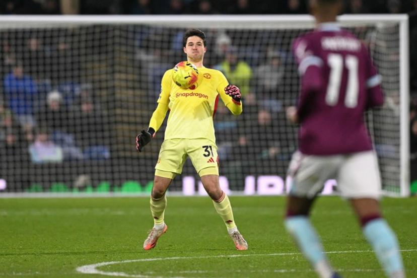 Manchester United's Belgian goalkeeper #31 Senne Lammens controls the ball on his chest near the half-way line during the English Premier League football match between Burnley and Manchester United at Turf Moor in Burnley, north-west England on January 7, 2026.  Oli SCARFF / AFP
