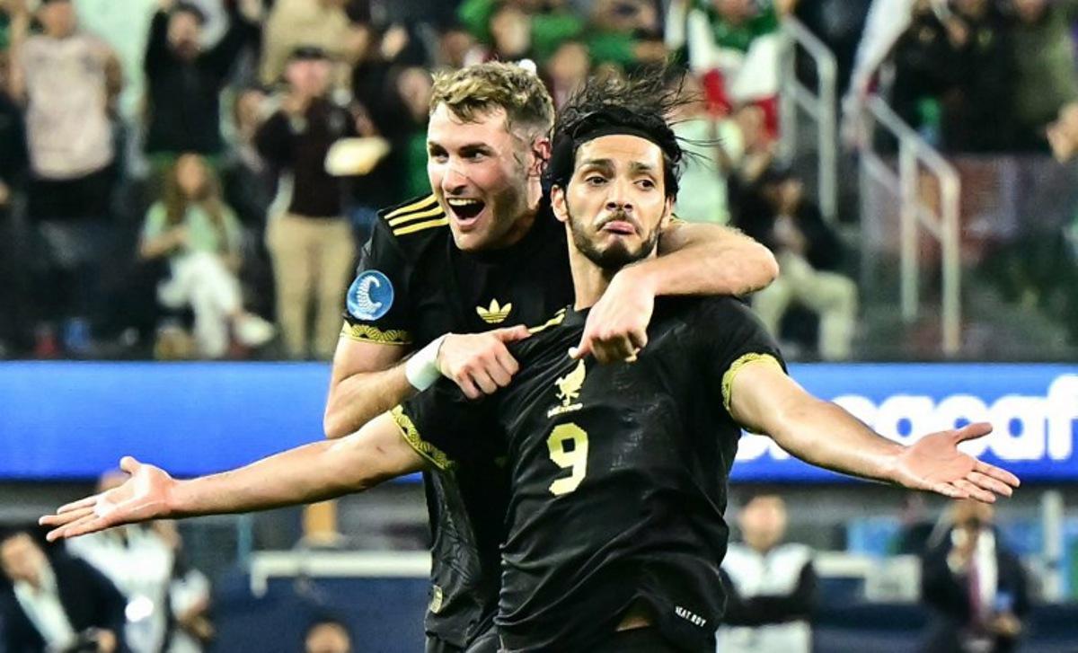 Mexico's forward #11 Santiago Gimenez jumps on Mexico's forward #09 Raul Jimenez who just scored their team's second goal during the CONCACAF Nations League semifinal football match between Canada and Mexico at SoFi Stadium in Inglewood, California, on March 20, 2025.  Frederic J. Brown / AFP