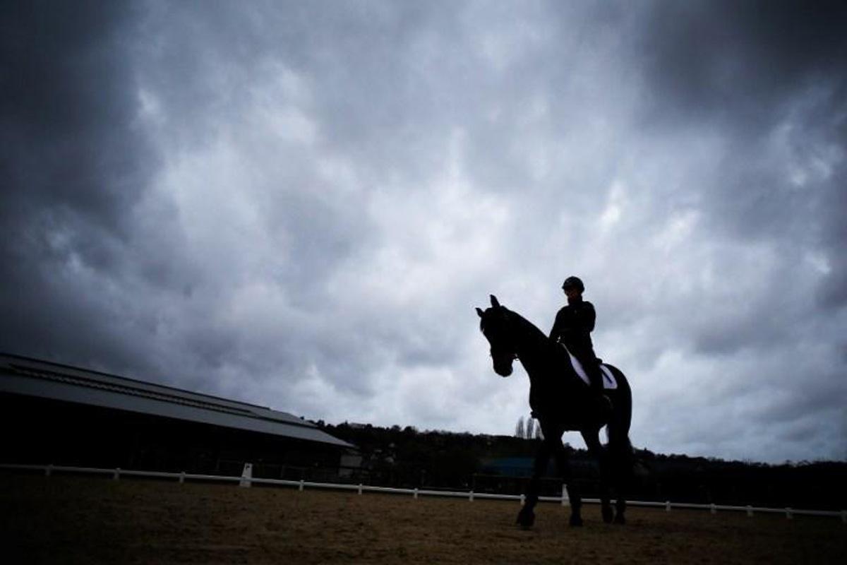 A rider exercises a horse at the Pole International du Cheval (International Horse Center) on April 4, 2018 the day before the official start of the  7th Deauville CPEDI (International Para-Equestrian Dressage Competition) in the northwestern French city of Deauville.   The best French para-equestrian dressage riders will compete in the CPEDI, each hoping to win a place on the French team to compete in September 2018 in the International Equestrian Federation (FEI) World Equestrian Games in Tyron, North Carolina. CHARLY TRIBALLEAU / AFP
