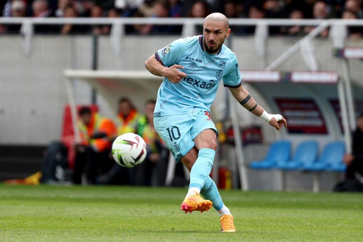 Reims' Maltese French midfielder #10 Teddy Teuma shoots the ball during the French L1 football match between Clermont Foot 63 and Stade de Reims at the Gabriel Montpied stadium in Clermont-Ferrand, central France, on April 28, 2024.  ROMAIN PERROCHEAU / AFP