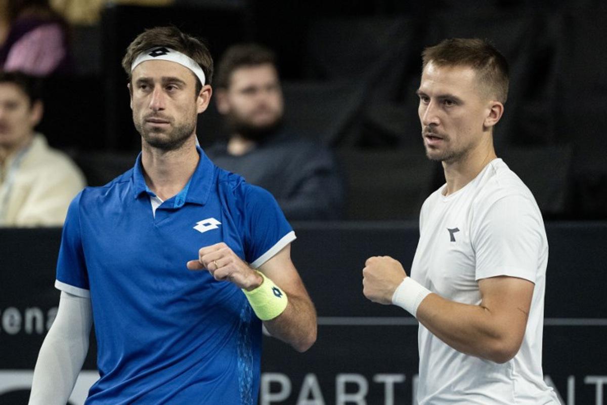 Belgium's Sander Gille (L) and Poland's Jan Zielinski (R) react during their men's doubles final tennis match against France's Benjamin Bonzi and France's Pierre-Hughes Herbert at the Marseille Open 13 ATP World Tour in Marseille, southern France on February 16, 2025.  MIGUEL MEDINA / AFP