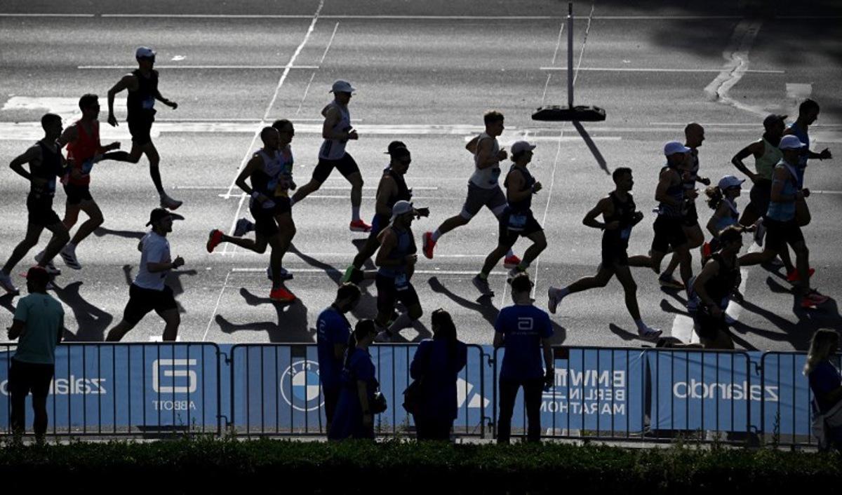 Runners take part in the 51st edition of the Berlin Marathon in Berlin, Germany on September 21, 2025.  Tobias SCHWARZ / AFP