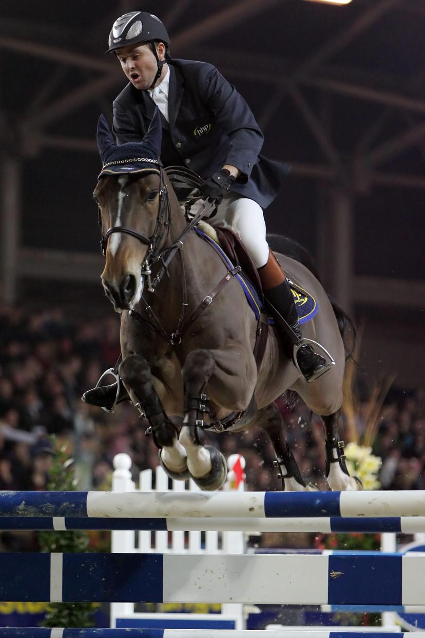 BRU126 - 20060226 - HASSELT, BELGIUM: Lieven Devos rides Peter van Spalbeek Z during the last day of the CSI Jumping of Hasselt, Sunday 26 Februray 2006. BELGA PHOTO YORICK JANSENS