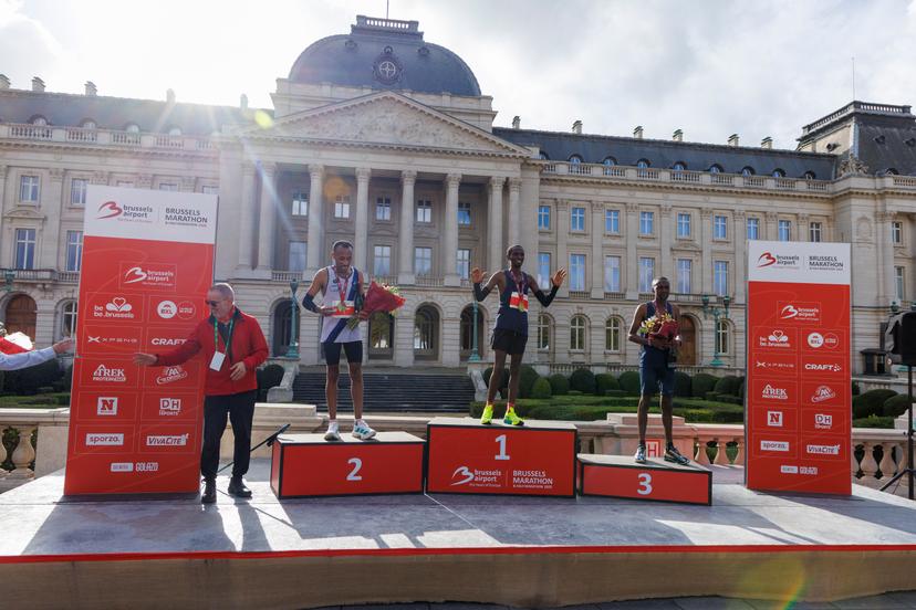 Ethiopian Solomon Belayneh, Kenyan Hillary Mutai and Kenyan Felix Mutai celebrate on the podium of the 2025 Brussels Marathon race on Sunday 02 November 2025 in Brussels. BELGA PHOTO NICOLAS MAETERLINCK