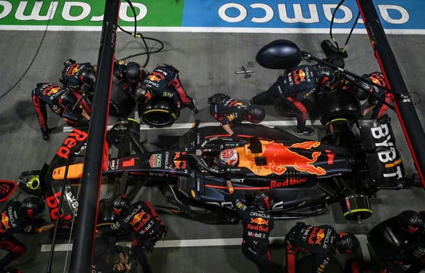 Mechanics work on the car of Red Bull Racing's Dutch driver Max Verstappen in the pit lane during the Singapore Formula One Grand Prix night race at the Marina Bay Street Circuit in Singapore on September 17, 2023.  MOHD RASFAN / AFP