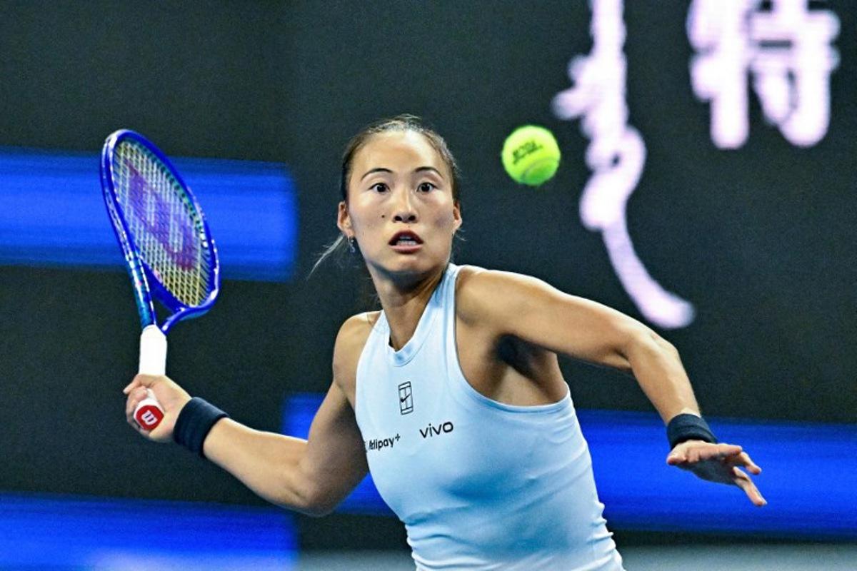 China's Zheng Qinwen hits a return to Czech Republic's Linda Noskova during their women's singles match at the China Open tennis tournament in Beijing on September 29, 2025.  Pedro PARDO / AFP