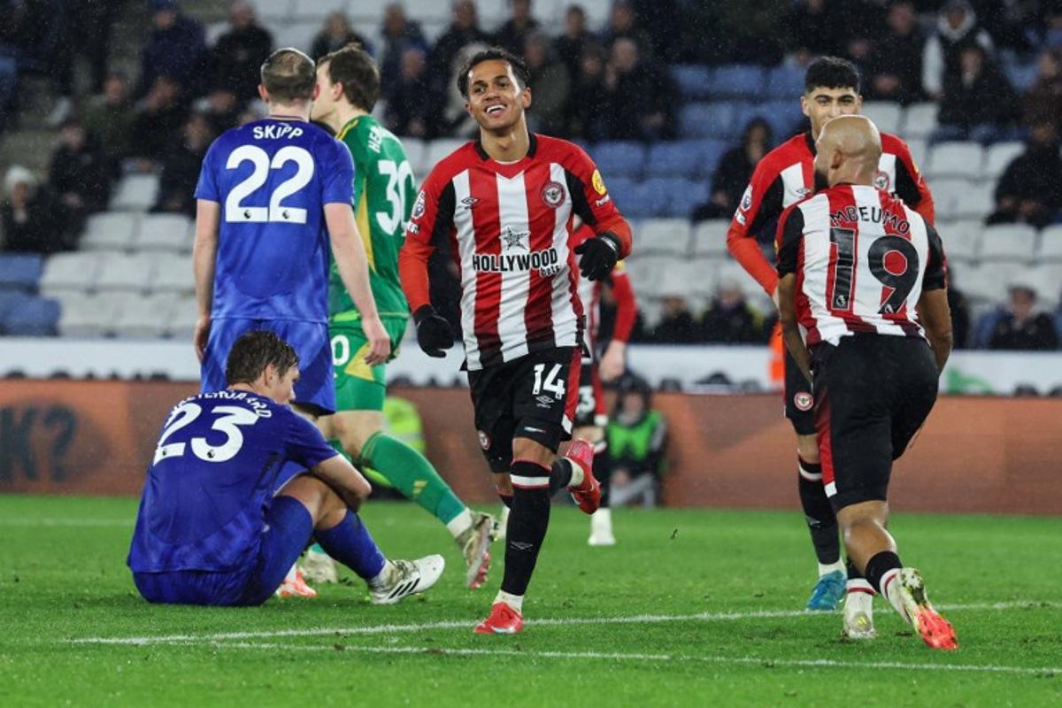 Brentford's Portuguese midfielder #14 Fabio Carvalho (C) celebrates after scoring his team fourth goal during the English Premier League football match between Leicester City and Brentford at King Power Stadium in Leicester, central England on February 21, 2025.  Darren Staples / AFP