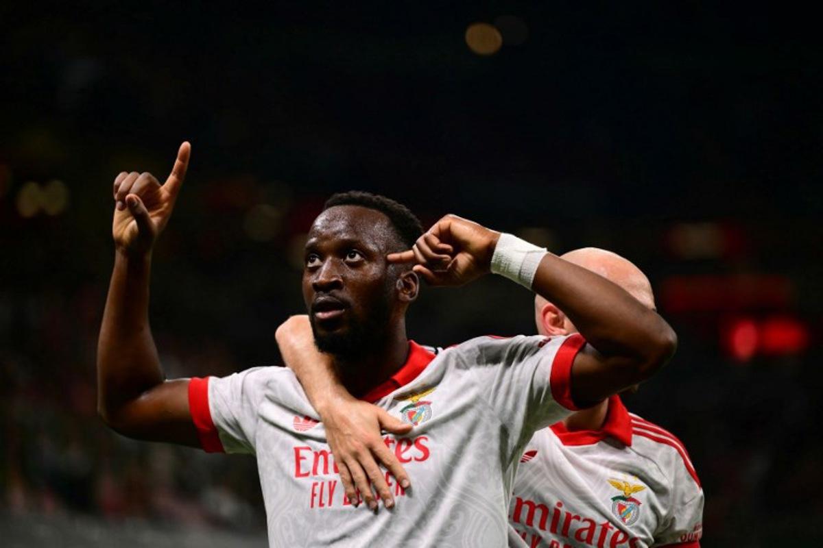 Benfica's Belgian forward #11 Dodi Lukebakio celebrates his team's first goal during the UEFA Europa League 1st round day 1 football match between Ac Milan and Benfica at the San Siro Stadium in Milan on September 16, 2026.  Marco Bertorello / AFP
