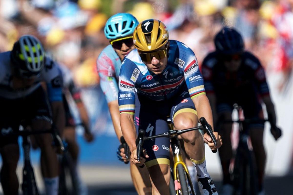 Belgium's Remco Evenepoel (Quick-Step) crosses the finish line of the second stage of the Tour of Romandie UCI cycling World tour, 157km loop from the start to the finish in La Grande Beroche, in Saint-Aubin-Sauges on May 1, 2025.  Fabrice COFFRINI / AFP