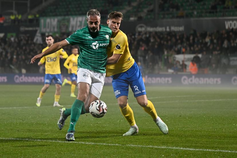 Lommel's Ralf Seuntjens and Beveren's Viktor Boone fight for the ball during a soccer game between Lommel SK and SK Beveren, Friday 07 November 2025 in Lommel, on day 13 of the 2025-2026 'Challenger Pro League' 1B second division of the Belgian championship. BELGA PHOTO JOHAN EYCKENS