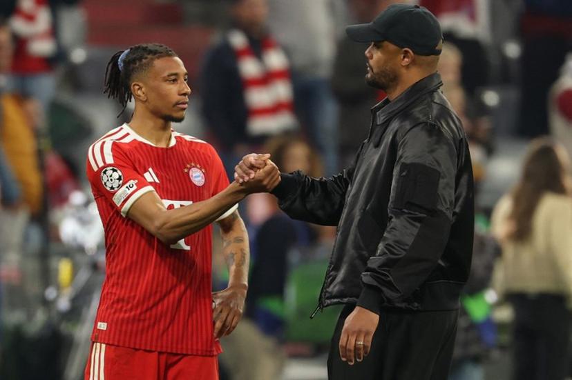 Bayern Munich's French midfielder #17 Michael Olise and Bayern Munich's Belgian head coach Vincent Kompany shake hands after the UEFA Champions League second-leg, semi-final football match between FC Bayern Munich and Paris Saint-Germain (PSG) in Munich, southern Germany on May 6, 2026.  Odd ANDERSEN / AFP