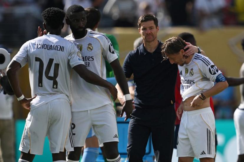 Real Madrid's French midfielder #14 Aurelien Tchouameni, German defender #22 Antonio Ruediger, Spanish coach Xabi Alonso and Croatian midfielder #10 Luka Modric react at the end of the FIFA Club World Cup 2025 semifinal football match between France's Paris Saint-Germain and Spain's Real Madrid at the MetLife stadium in East Rutherford, New Jersey on July 9, 2025.  ANGELA WEISS / AFP