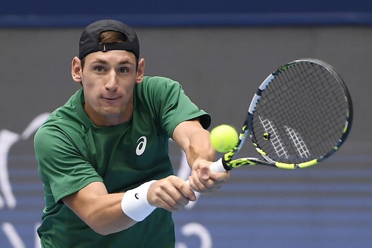 France's Valentin Royer hits a return to USA's Learner Tien during their men's singles quarter-final match at the Hangzhou Open tennis tournament in Hangzhou, in China's eastern Zhejiang province on September 21, 2025.  STR / AFP
