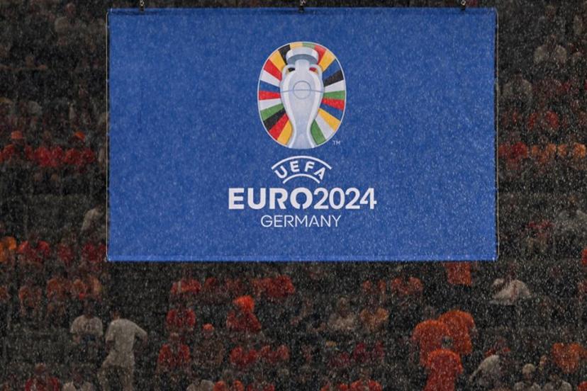 Rain falls in front of the UEFA logo before the start of the UEFA Euro 2024 semi-final football match between the Netherlands and England at the BVB Stadion in Dortmund on July 10, 2024.  Kirill KUDRYAVTSEV / AFP