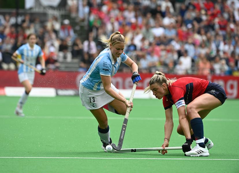 Gantoise's Alix Gerniers and Dragons' Valerie Magis fight for the ball during a hockey game between KHC Dragons and Gantoise, Sunday 21 May 2023 in Brasschaat, the second leg of the finals in the play-offs for the Belgian Women Hockey League season 2022-2023. BELGA PHOTO JOHN THYS