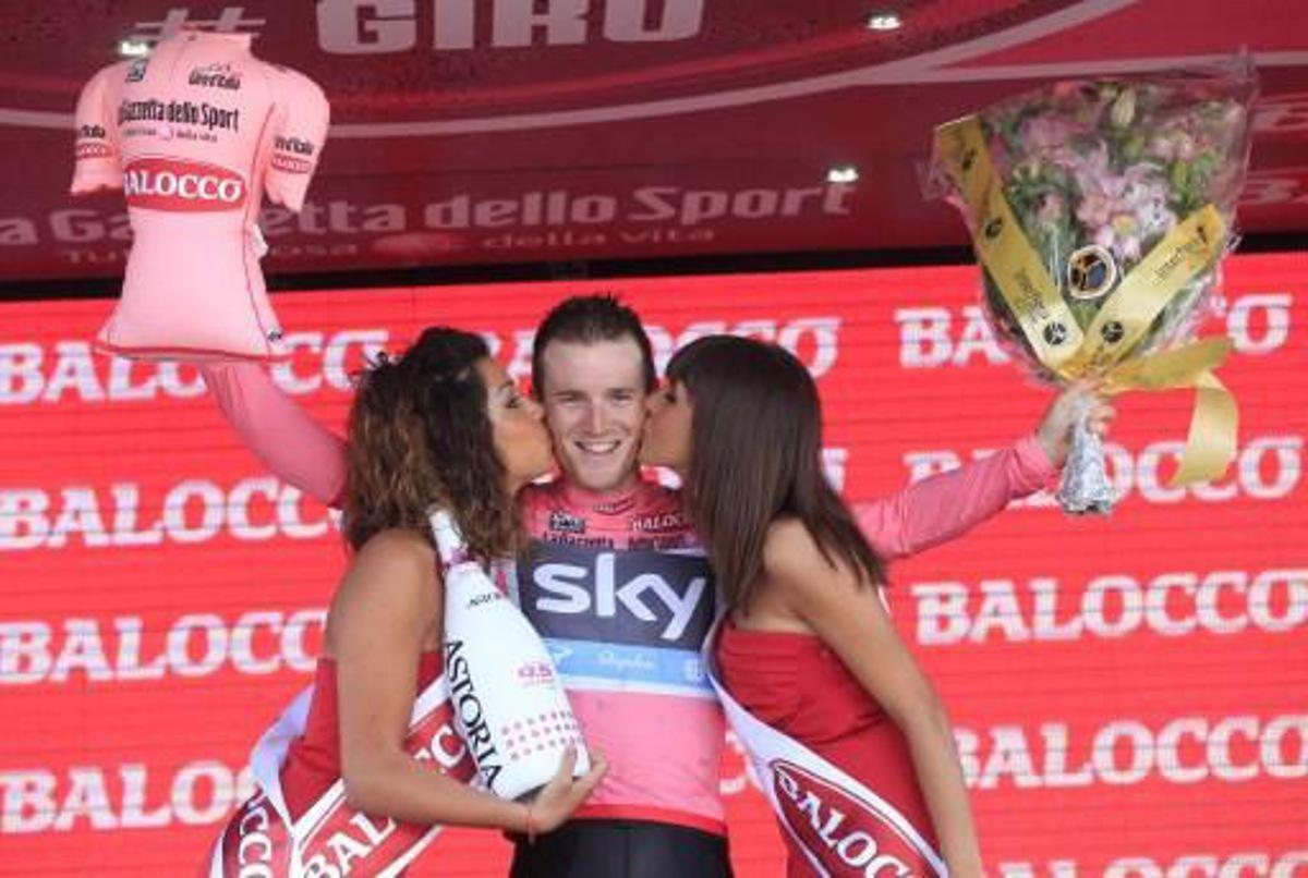 Italian Salvatore Puccio celebrates on the podium gaining the pink jersey on the podium of the second stage of 96th Giro d'Italia Team Time Trial, a 17.4 km from Ischia to Forio on May 5, 2013 in Forio, on the island of Ischia. Italian Salvatore Puccio of Team Sky took possession of the Giro d'Italia pink jersey from overnight leader Mark Cavendish on Sunday after Team Sky dominated a stage two team time trial on the island of Ischia.  AFP PHOTO / LUK BENIES