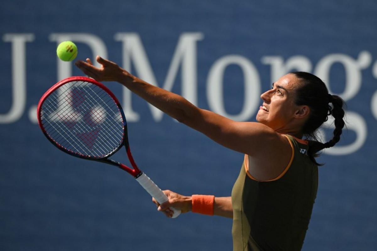 France's Caroline Garcia serves to Russia's Kamilla Rakhimova during their women's singles first round tennis match on day two of the US Open tennis tournament at the USTA Billie Jean King National Tennis Center in New York City, on August 25, 2025.  ANGELA WEISS / AFP
