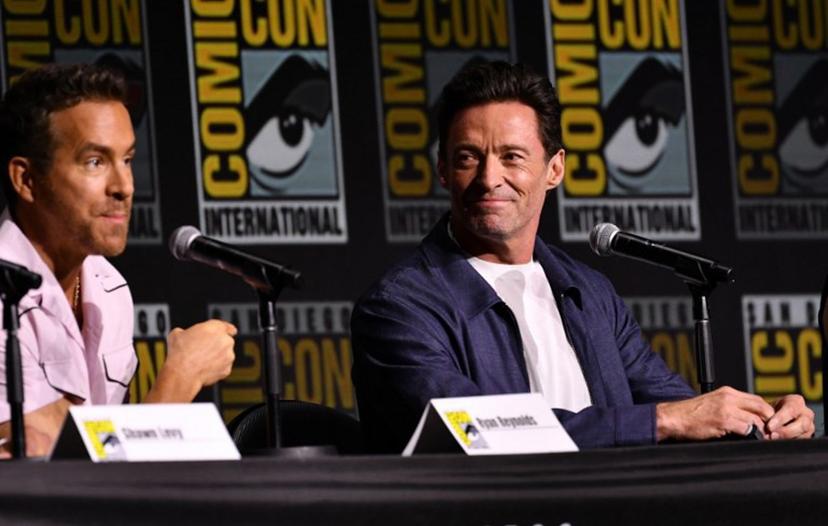 Canadian actor Ryan Reynolds (L) and Australian actor Hugh Jackman speak on stage during "Deadpool and Wolverine" celebration of life fan event during Comic Con International in San Diego, California, July 25, 2024.  Chris DELMAS / AFP