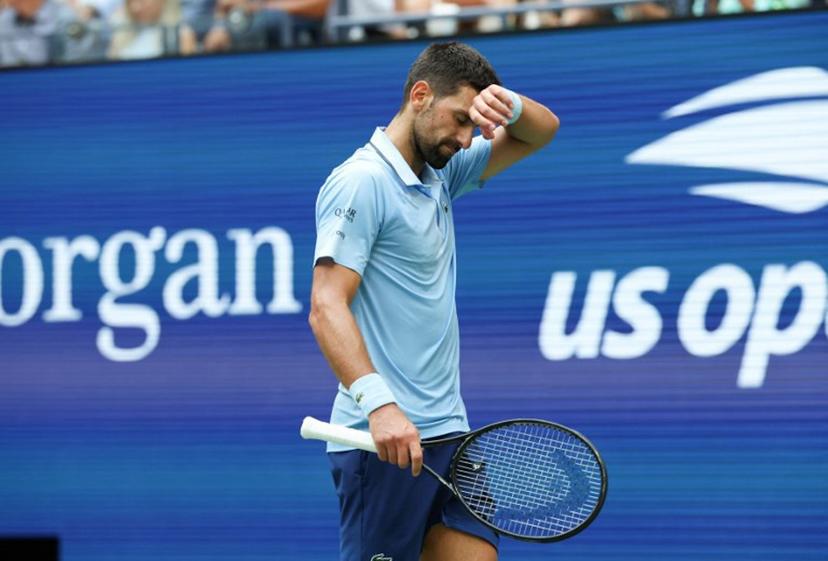 Serbia's Novak Djokovic gestures during the men's singles semifinal tennis match against Spain's Carlos Alcaraz on day thirteen of the US Open tennis tournament at the USTA Billie Jean King National Tennis Center in New York City, on September 5, 2025.  TIMOTHY A. CLARY / AFP