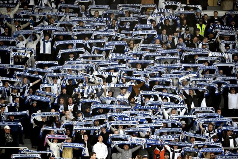 Finland fans display their scarves prior to the 2026 FIFA World Cup Qualifying Group G football match between Finland and Poland in Helsinki on June 10, 2025.   Markku Ulander / LEHTIKUVA / AFP